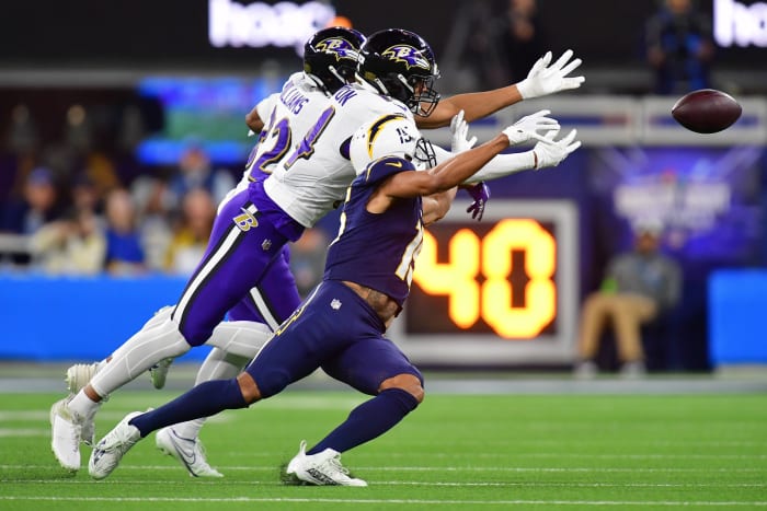 Nov 26, 2023; Inglewood, California, USA; Baltimore Ravens safety Kyle Hamilton (14) and safety Marcus Williams (32) block a pass intended for Los Angeles Chargers wide receiver Jalen Guyton (15) during the first half at SoFi Stadium. Mandatory Credit: Gary A. Vasquez-USA TODAY Sports